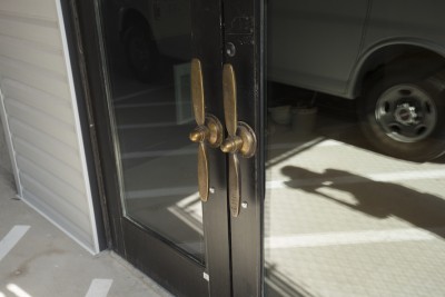 From the entrance from the secured garage, visitors and residents are greeted by custom bronze door handles in the shape of the Corsair propeller, once manufactured on the site of the new apartments in New Haven.